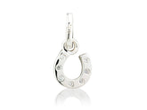 A sterling silver horseshoe charm with cubic zirconia stones embedded within it.